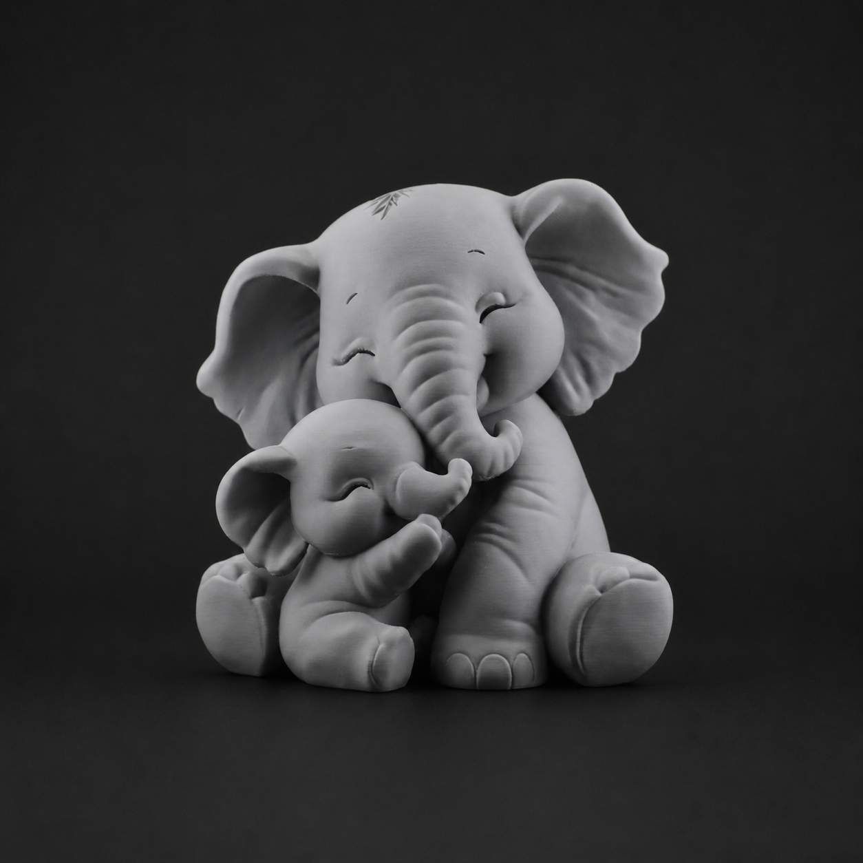 Baby elephant hug sculpture in gray