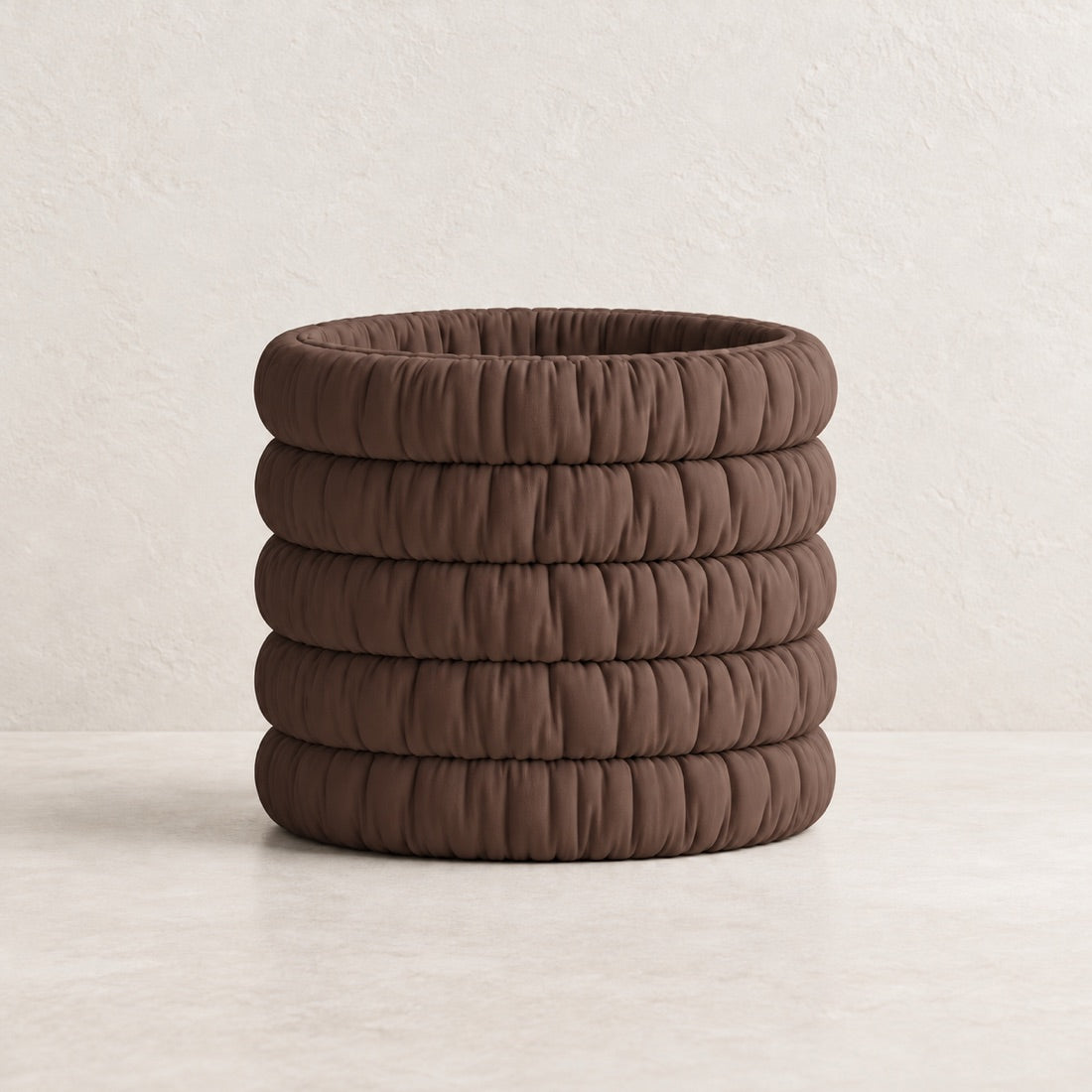 Mossmallow Planter in Cocoa Brown (#5C4037), empty pot with warm plaster background and pale tabletop