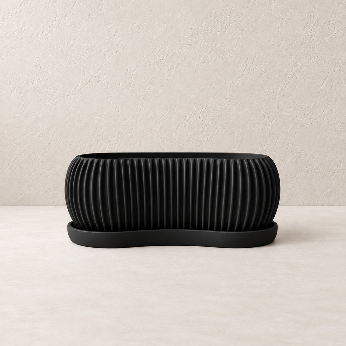 Sagefold Planter in Black #000000; matching color on planter body and tray